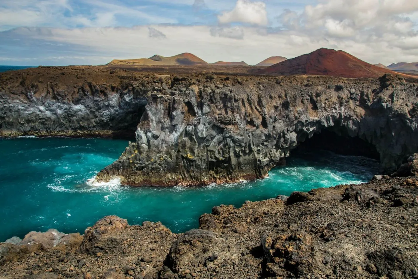 Los Hervideros Cliffs with roaring waves.